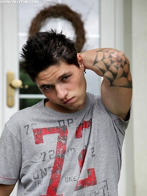 Hot twinks porn pics - Tattooed stud Jeremy stroking his cock outdoors.