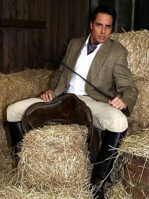 Gay porn pics Marcello dressed in full riding suit masturbating in the stables