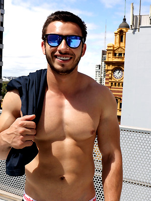 Gay male in Australian Muscle - James Nowak strips naked on the roof