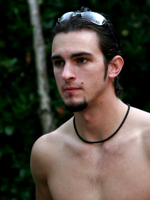 Gay sex pics with Gays Kyle and Phenix Saint jack off their dongs on an outdoor massage table
